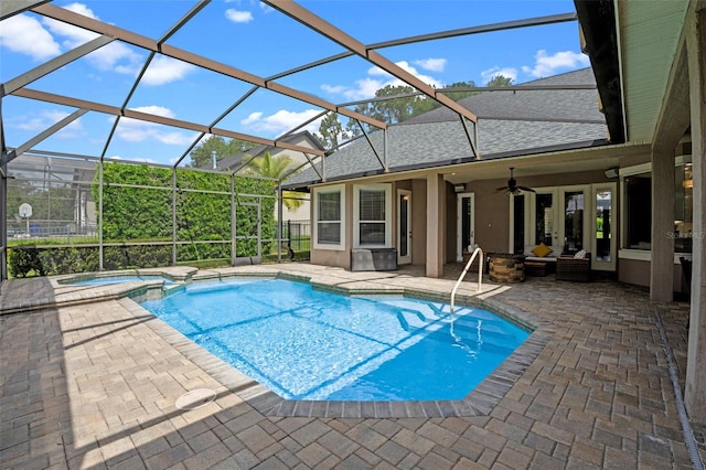 5108 Sailwind Cir, Orlando, FL 32810 - view of pool with a patio area, a pool with connected hot tub, a ceiling fan, and glass enclosure