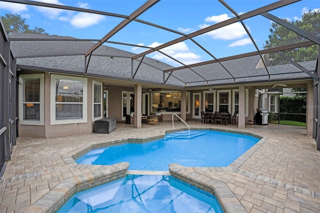 5108 Sailwind Cir, Orlando, FL 32810 - view of swimming pool featuring area for grilling, outdoor dining area, a patio area, a pool with connected hot tub, and a ceiling fan