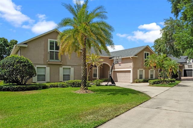 5108 Sailwind Cir, Orlando, FL 32810 - view of front of property with stucco siding, driveway, a front yard, and a garage