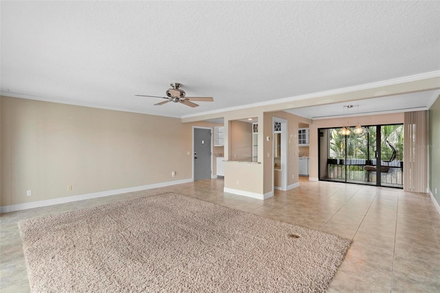 spare room featuring crown molding, baseboards, ceiling fan, and light tile patterned floors