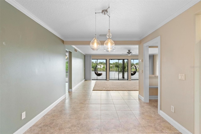 interior space with a water view, crown molding, baseboards, ceiling fan, and light tile patterned flooring