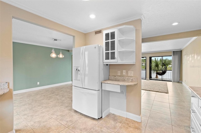 kitchen with crown molding, light tile patterned floors, visible vents, and white fridge with ice dispenser