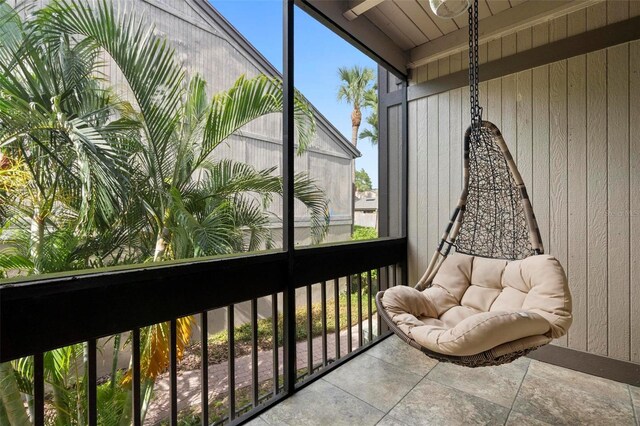 sunroom / solarium with plenty of natural light and beam ceiling