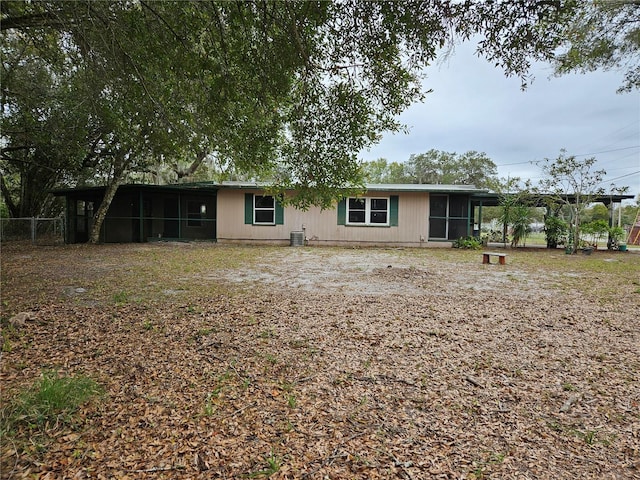 1424 Lake Shore Dr, Casselberry, FL 32707 - rear view of property with a sunroom, fence, and cooling unit
