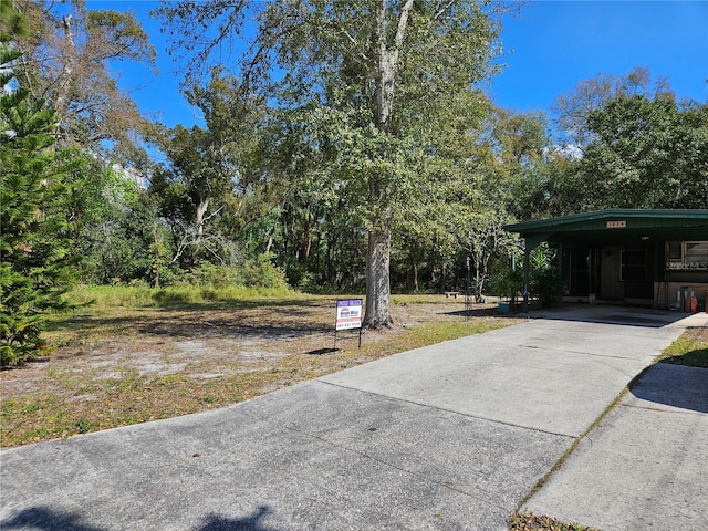 1424 Lake Shore Dr, Casselberry, FL 32707 - view of yard with concrete driveway and a carport