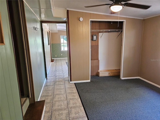 1424 Lake Shore Dr, Casselberry, FL 32707 - interior space featuring ceiling fan, wooden walls, a closet, and crown molding