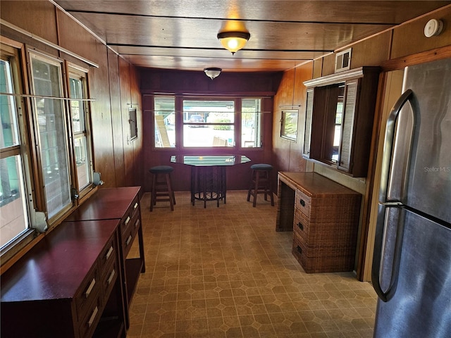 1424 Lake Shore Dr, Casselberry, FL 32707 - dining area featuring wooden walls and dark floors