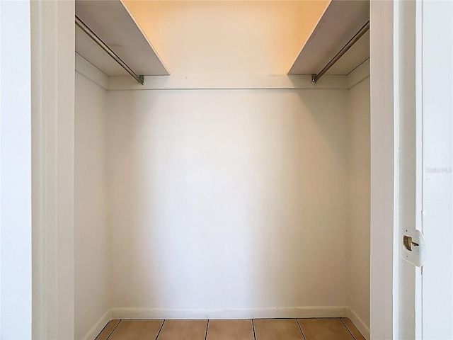 spacious closet with light tile patterned flooring