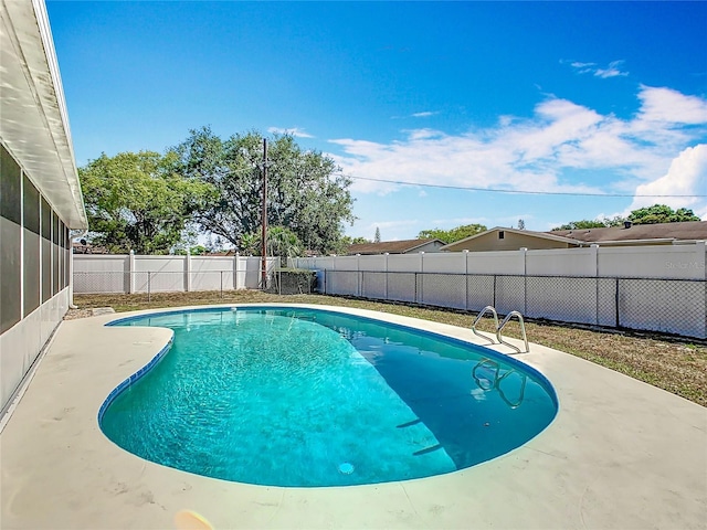 view of swimming pool with a patio area, a fenced in pool, and a fenced backyard