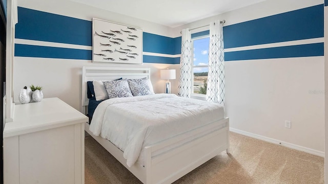 bedroom featuring carpet and baseboards