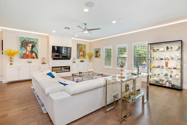 1831 Mizell Ave, Winter Park, FL 32789 - living area featuring a ceiling fan, light wood-style floors, recessed lighting, a fireplace, and baseboards