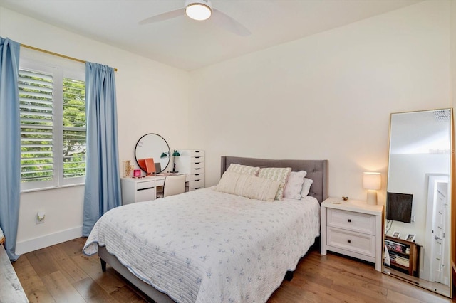 1831 Mizell Ave, Winter Park, FL 32789 - bedroom with wood finished floors, a ceiling fan, and baseboards
