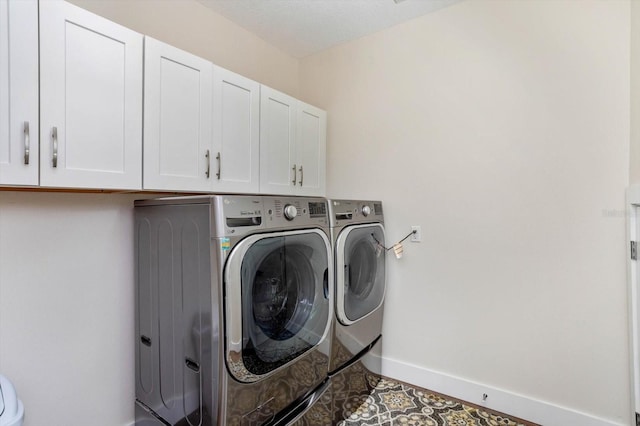 1831 Mizell Ave, Winter Park, FL 32789 - laundry room featuring separate washer and dryer, cabinet space, and baseboards
