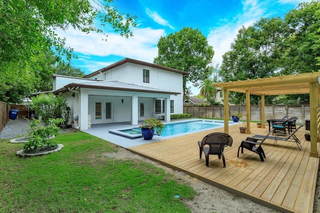 1831 Mizell Ave, Winter Park, FL 32789 - rear view of property featuring french doors, a wooden deck, stucco siding, metal roof, and a standing seam roof