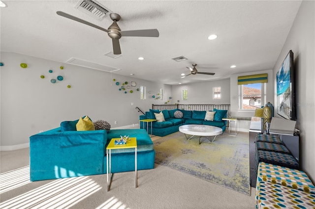 carpeted living area featuring attic access, visible vents, ceiling fan, and recessed lighting