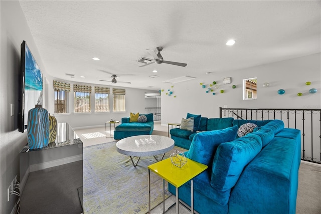 living room with a ceiling fan, recessed lighting, baseboards, and visible vents