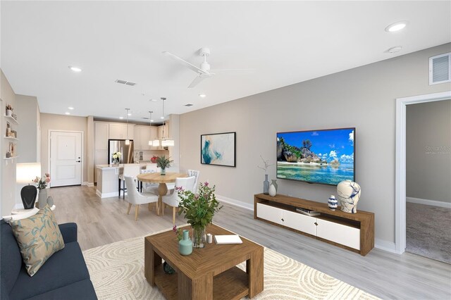 7565 Laureate Blvd Unit 3408, Orlando, FL 32827 - living area featuring light wood-style flooring, baseboards, recessed lighting, and ceiling fan