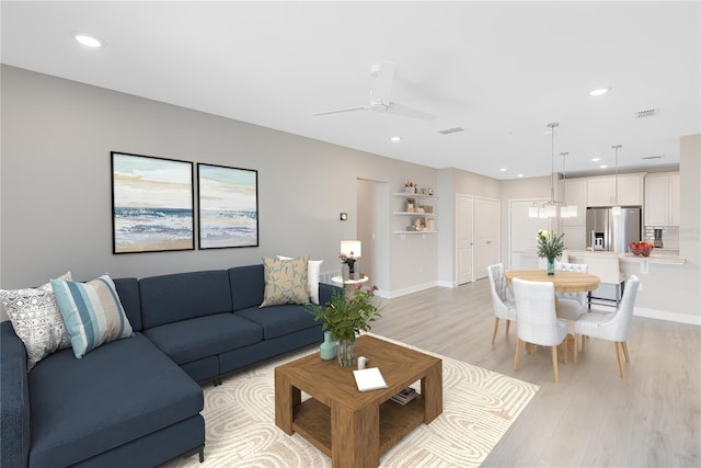 7565 Laureate Blvd Unit 3408, Orlando, FL 32827 - living area featuring light wood-style flooring, recessed lighting, baseboards, and a ceiling fan