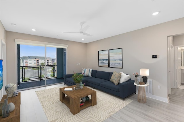 7565 Laureate Blvd Unit 3408, Orlando, FL 32827 - living area featuring light wood-style floors, baseboards, a ceiling fan, and recessed lighting