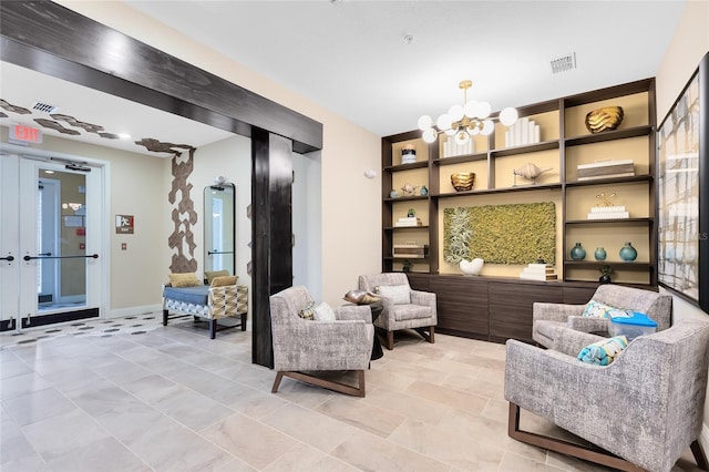 7565 Laureate Blvd Unit 3408, Orlando, FL 32827 - sitting room featuring a chandelier and baseboards