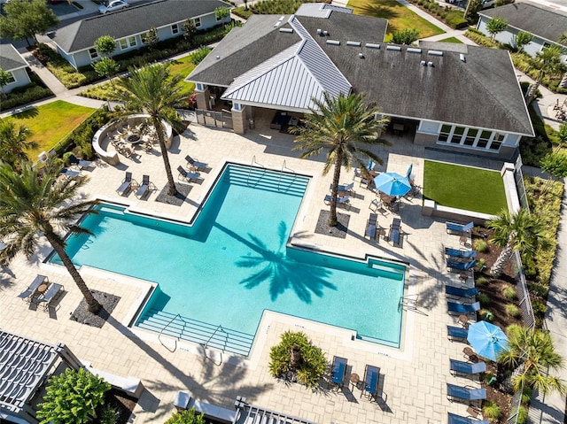 7565 Laureate Blvd Unit 3408, Orlando, FL 32827 - community pool with a patio area and fence