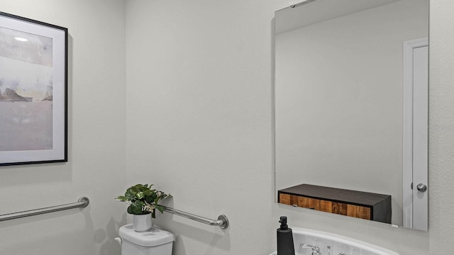 bathroom with a whirlpool tub