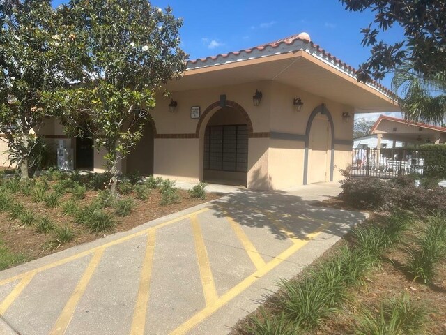 1707 E Schwartz Blvd, Lady Lake, FL 32159 - view of front facade featuring stucco siding and a tile roof