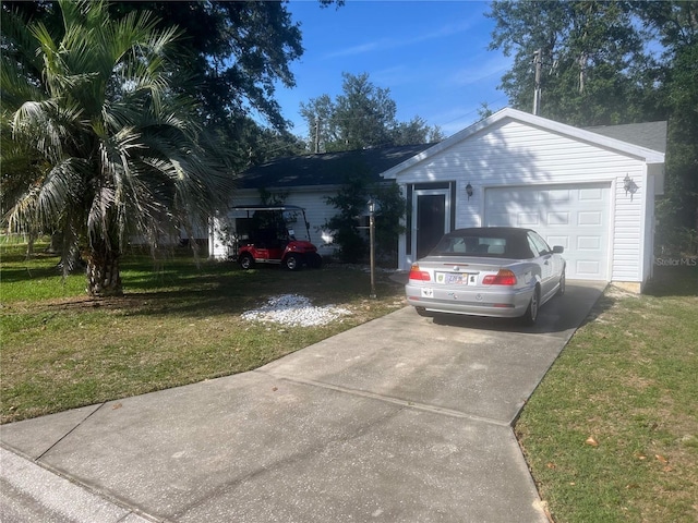 1707 E Schwartz Blvd, Lady Lake, FL 32159 - ranch-style home featuring concrete driveway, a front lawn, and a garage