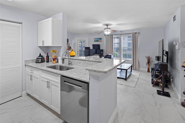 kitchen featuring a peninsula, a sink, stainless steel dishwasher, visible vents, and marble finish floor