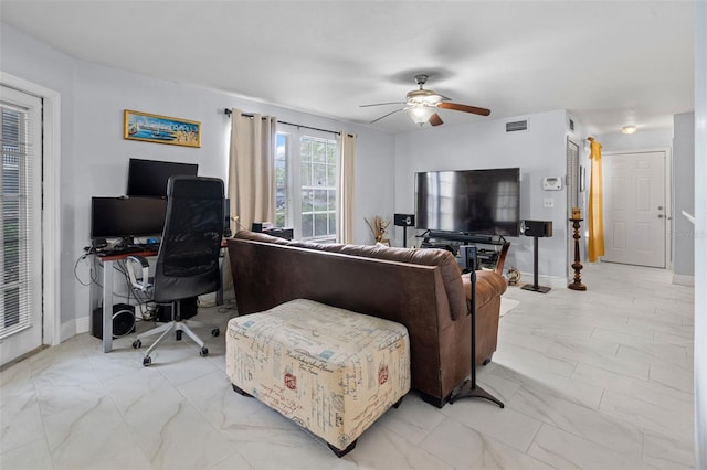 living room with a ceiling fan, marble finish floor, baseboards, and visible vents