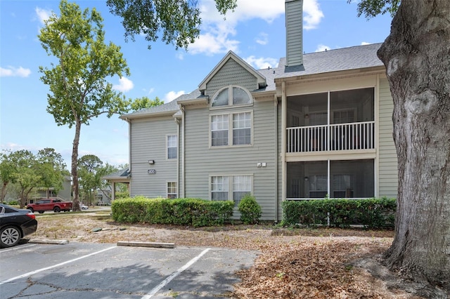view of property with uncovered parking