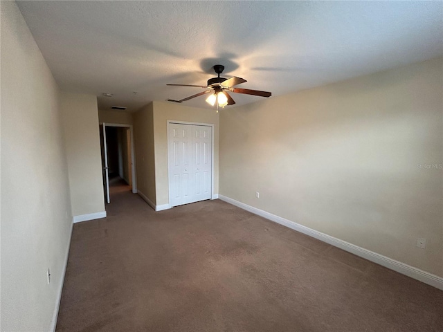135 Heritage Park St, Winter Springs, FL 32708 - unfurnished bedroom with baseboards, dark carpet, a closet, and ceiling fan