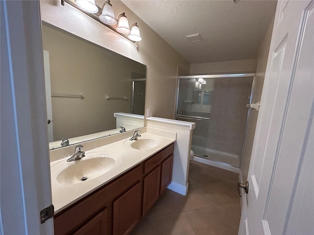 135 Heritage Park St, Winter Springs, FL 32708 - bathroom featuring a sink, double vanity, a shower stall, and tile patterned floors