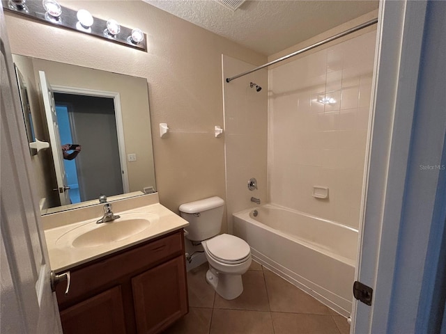 135 Heritage Park St, Winter Springs, FL 32708 - full bathroom featuring toilet, tile patterned floors, a textured ceiling, vanity, and shower / bathtub combination