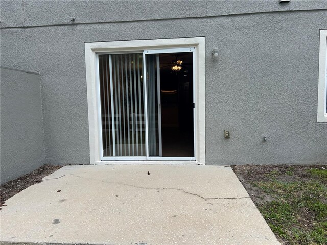 135 Heritage Park St, Winter Springs, FL 32708 - property entrance featuring a patio area