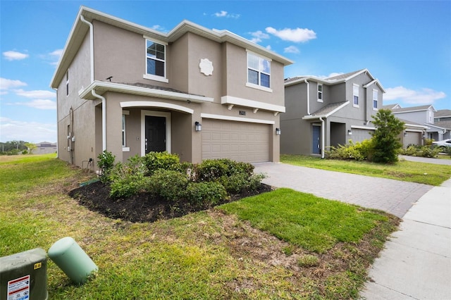 traditional home with a residential view, a garage, stucco siding, a front lawn, and driveway