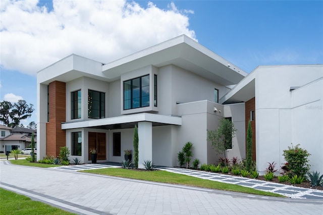 contemporary house with stucco siding