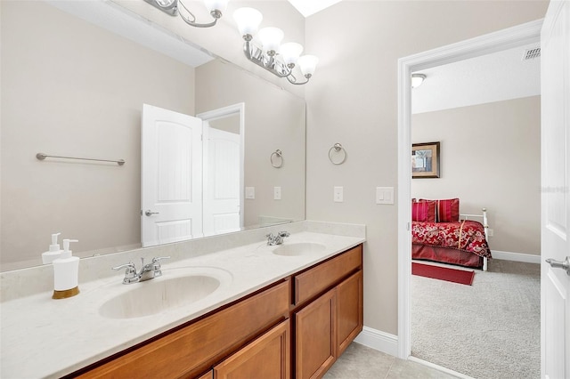 full bath with ensuite bath, visible vents, a sink, and double vanity