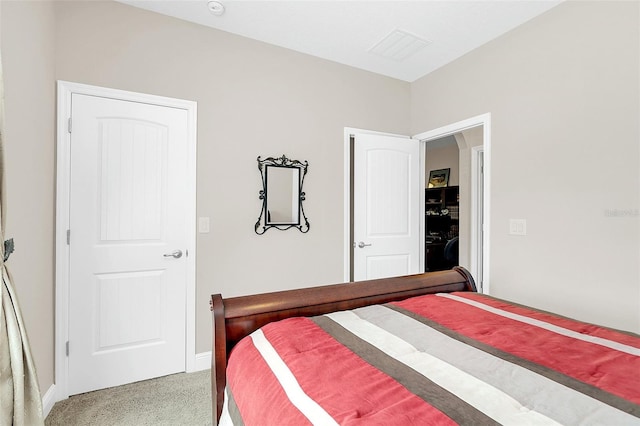 bedroom featuring carpet floors and baseboards