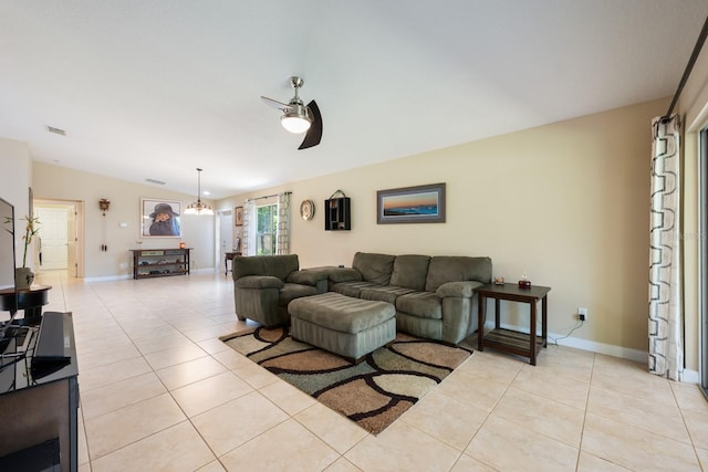 11908 Fiore Dr Unit 1, Orlando, FL 32827 - living area featuring light tile patterned flooring, a ceiling fan, baseboards, and vaulted ceiling