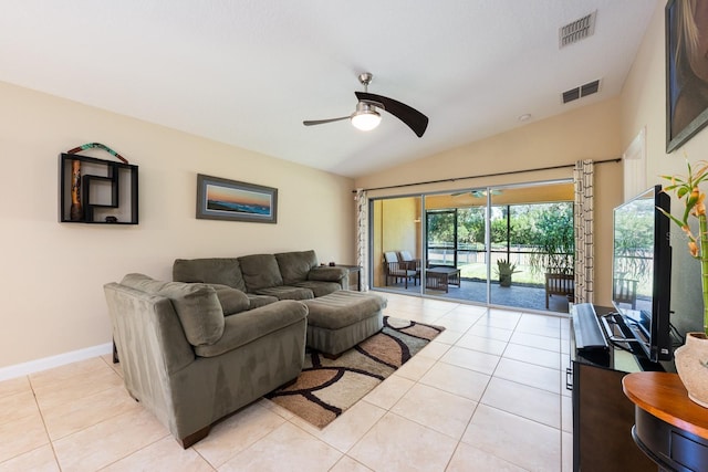 11908 Fiore Dr Unit 1, Orlando, FL 32827 - living area with ceiling fan, lofted ceiling, light tile patterned floors, and baseboards