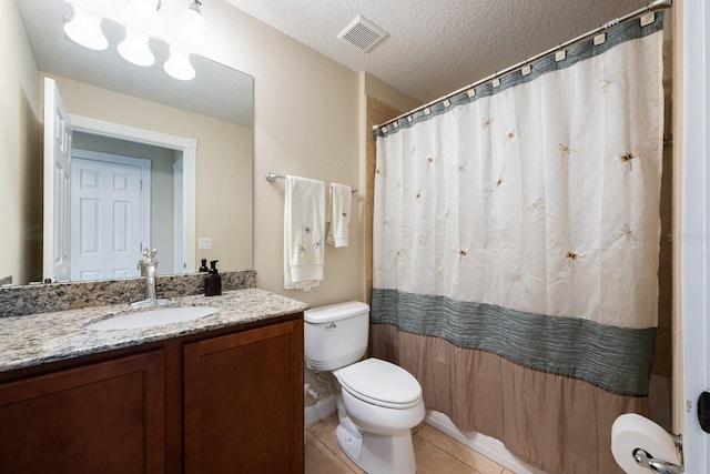 11908 Fiore Dr Unit 1, Orlando, FL 32827 - bathroom with toilet, vanity, tile patterned floors, a textured ceiling, and a shower with shower curtain