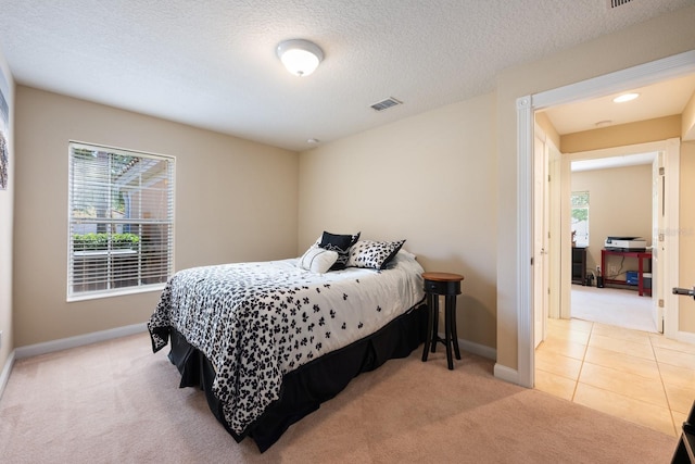 11908 Fiore Dr Unit 1, Orlando, FL 32827 - tiled bedroom with carpet flooring, baseboards, and a textured ceiling