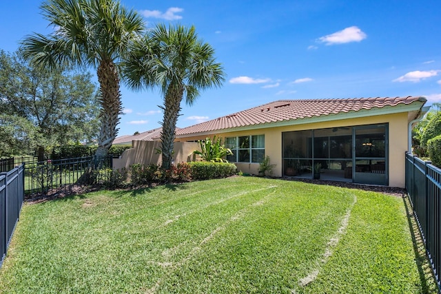 11908 Fiore Dr Unit 1, Orlando, FL 32827 - rear view of house with stucco siding, a tile roof, and a sunroom