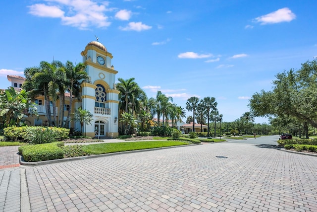 11908 Fiore Dr Unit 1, Orlando, FL 32827 - view of decorative road featuring curbs, sidewalks, and street lighting