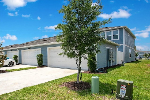 10940 Leafshore Loop, Orlando, FL 32829 - view of front of home featuring a front lawn, driveway, and a garage