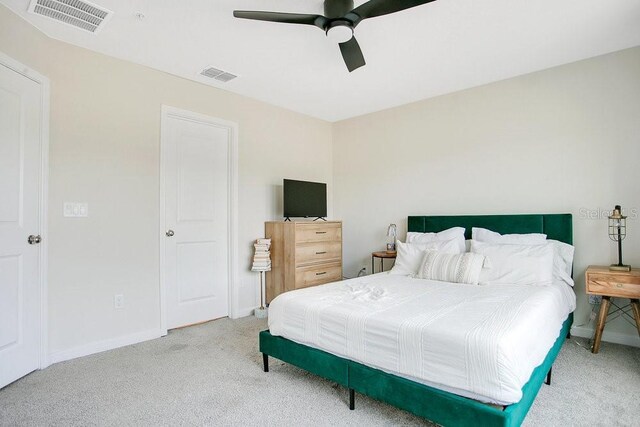 10940 Leafshore Loop, Orlando, FL 32829 - carpeted bedroom with baseboards and a ceiling fan