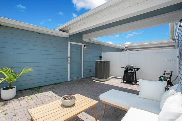 10940 Leafshore Loop, Orlando, FL 32829 - view of patio / terrace with central AC, outdoor lounge area, fence, and a grill