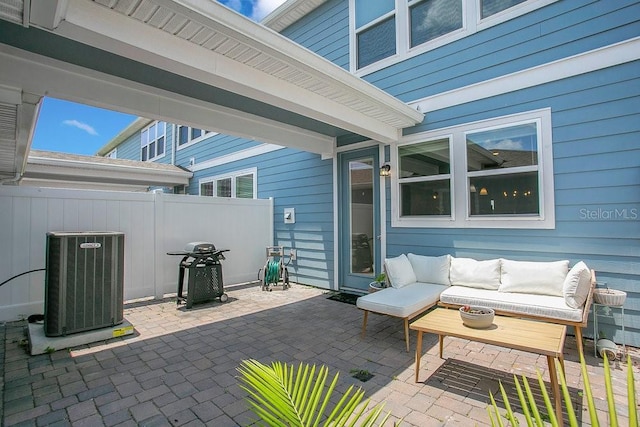 10940 Leafshore Loop, Orlando, FL 32829 - view of patio with cooling unit, fence, outdoor lounge area, and a grill