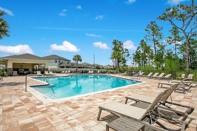 10940 Leafshore Loop, Orlando, FL 32829 - community pool with fence and a patio area